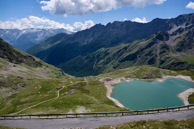 View out over Lago Nero near the Gavia climb with a view out over the valley behind it