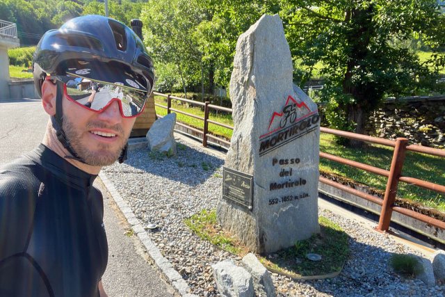 Cyclist at the base of the Mortirolo climb near Bormio, Italy