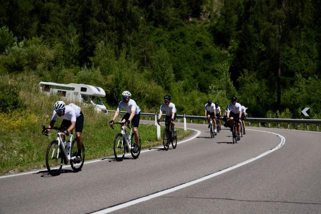Cyclists group riding in Switzerland on their way to Stelvio