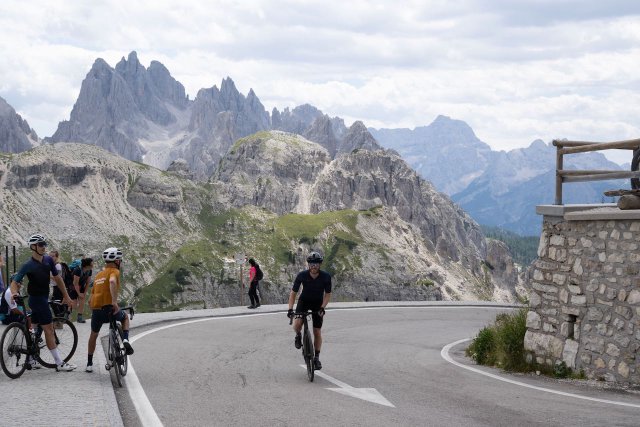 Cyclist climbing out of the saddle near the top of the Tre Cime di Lavaredo climb
