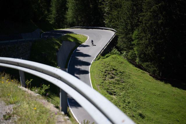 Cyclist descending the Passo Umbrail into Switzerland from Passo dello Stelvio