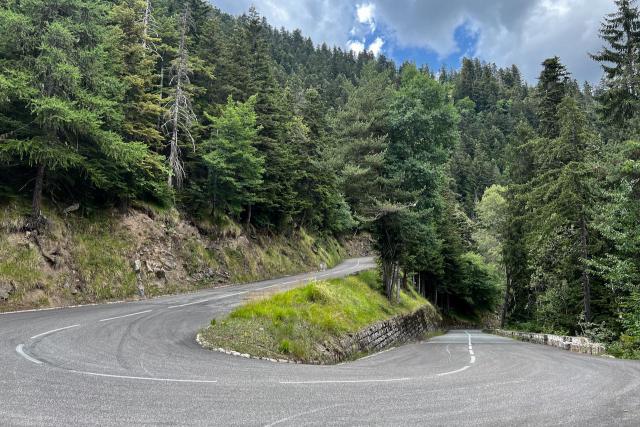 View over a switchback in the road near the top of the Col de Turini