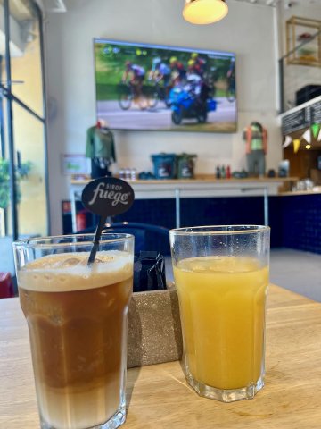 What more can you ask for? Drinks on a table at the Cafe du Cycliste cafe watching a live professional cycling event in Nice, France
