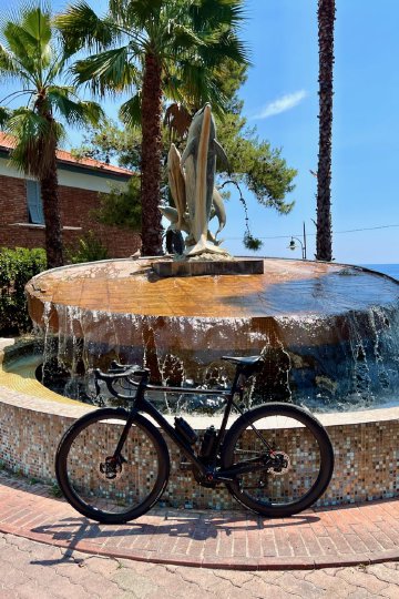 Dolphin statue near the start of the Ospedaletti bike path in Italy