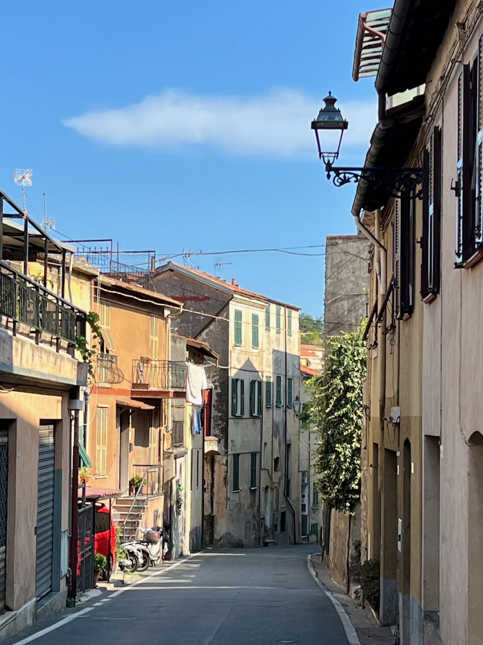 View near the top of the Poggio with an Italian lamppost and historic buildings