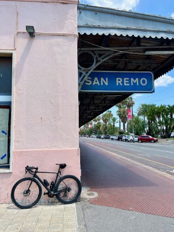 Bicycle against the side of the Sanremo train depot that has since been repurposed as part of the Ospedaletti bike path
