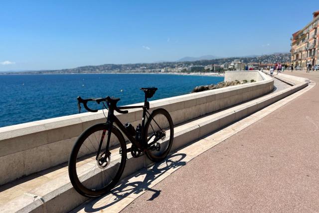 Factor O2 VAM bicycle leaning against a wall overlooking the Mediterranean Sea and Nice, France