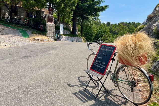 Bicycle with menu for Le Truck du Col at the top of the Col de la Madone