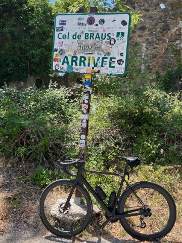 Almost uneventful, but beautiful, I definitely added my sticker to this sign Factor O2 VAM bicycle leaning against the Col de Braus sign at the top of the climb
