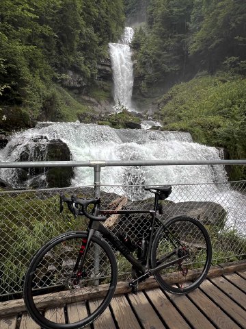 Reminded me a bit of Multnomah falls in Portland, Oregon, actually Bicycle propped against a fence in front of Giessbach falls in Switzerland