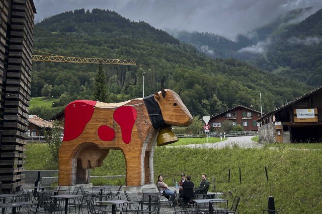 Giant wooden cow outside a food hall at Hofstetten, Switzerland