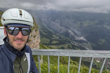 It was FREEZING up there, notice ALL the layers! Cyclist selfie looking down on the Lauterbrunnen valley from Männlichen