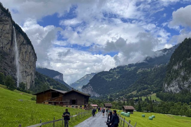 Tourists in Lauterbrunnen enjoying the rainy day.