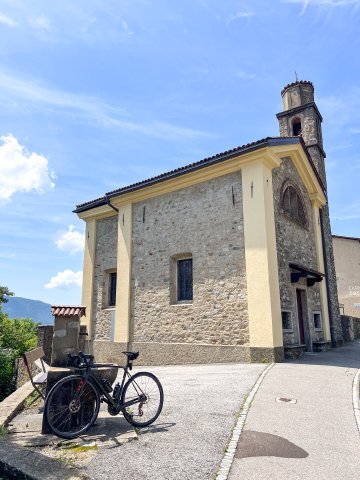 That fountain came at the perfect time! Bicycle near a small water fountain outside a church in Bombinasco, Switzerland