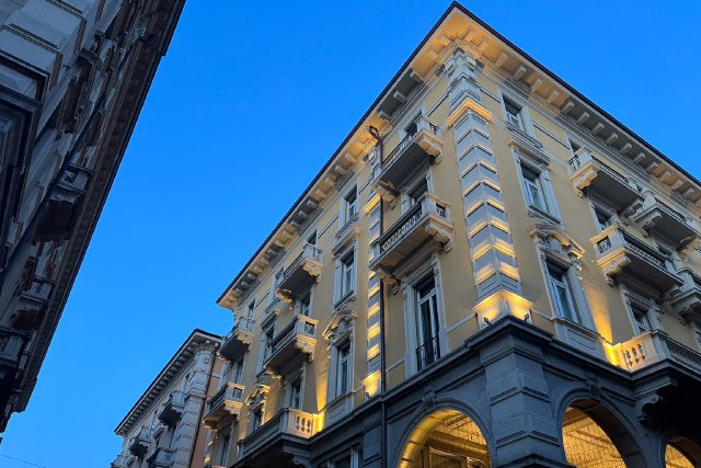 Upward lights on a building at dusk in Lugano, Switzerland
