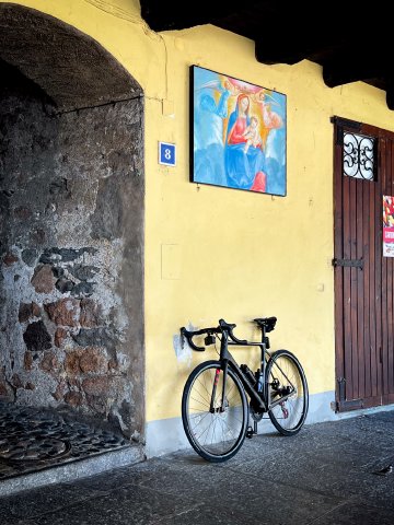 I didn't intend for this one to be so artsy, but it's one of my favorites from the trip Bicycle leaning against a wall in front of artwork in Marcote, Switzerland