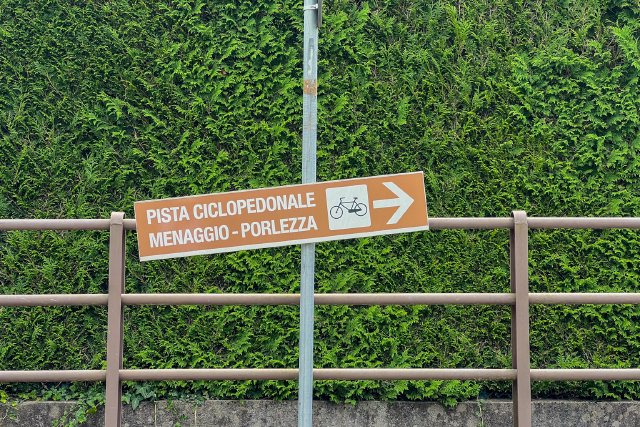 Road sign indicating where the bike path was near Menaggio, Italy.