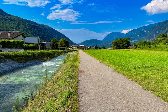 Bike path with river beside it near Lugano, Switzerland