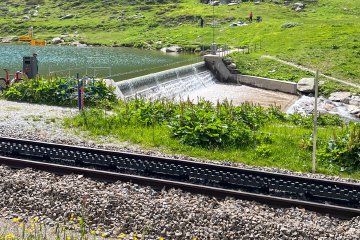 What a small thing that I was fascinated by Close up of the train track with third rail for the train line up to the Oberalppass