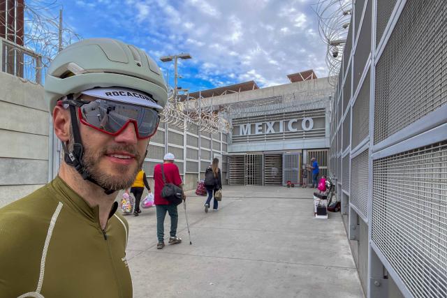Cyclist selfie at the pedestrian gate of Mexico in San Diego / Tijuana
