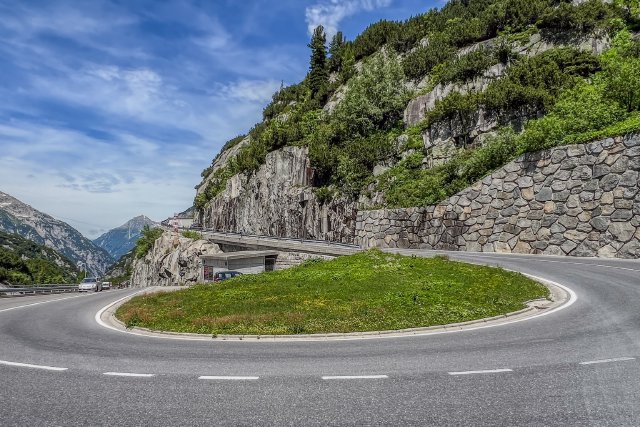 Sharp 180 degree bend along road near a dam on the Grimselpass.