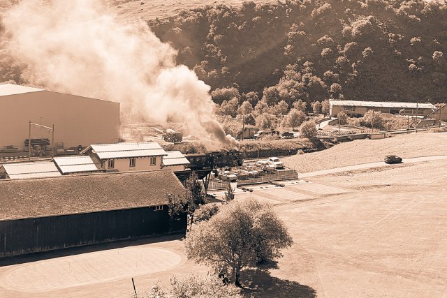 Old steam locomotive train in Realp leaving the station
