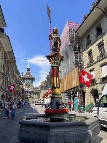 The Zähringerbrunnen, a famous fountain with the Bernese bear on top, their symbol View of the Zähringerbrunnen Bernese bear fountain in Bern, Switzerland, with the Zytglogge behind it