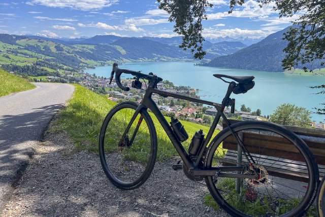 Bicycle against a park bench overlooking Lake Ägerisee near Zürich.