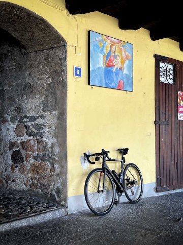 I didn't intend for this one to be so artsy, but it's one of my favorites from the trip Bicycle leaning against a wall in front of artwork in Marcote, Switzerland