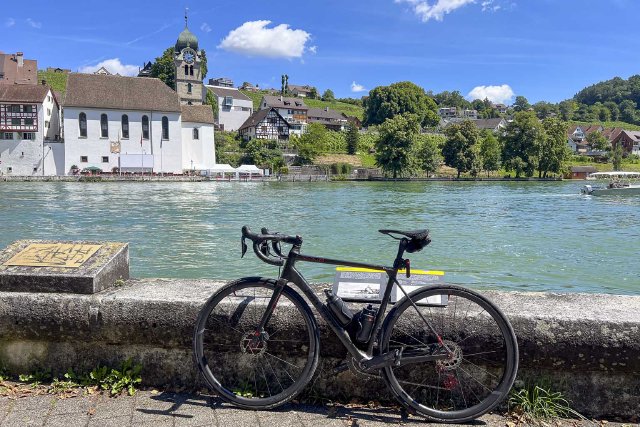 Photo of bicycle leaning against a wall at the Rhine River in Eglisau, Switzerland