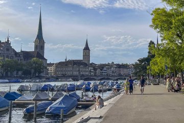 I'm so glad I took this walk near the lake! Cityscape of Zürich with several clocktowers in the background