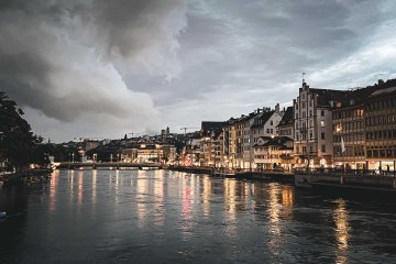 Such a beautiful spot at night, even with the clouds that day. Night view over the city of Zürich with Lake Zürich in the foreground