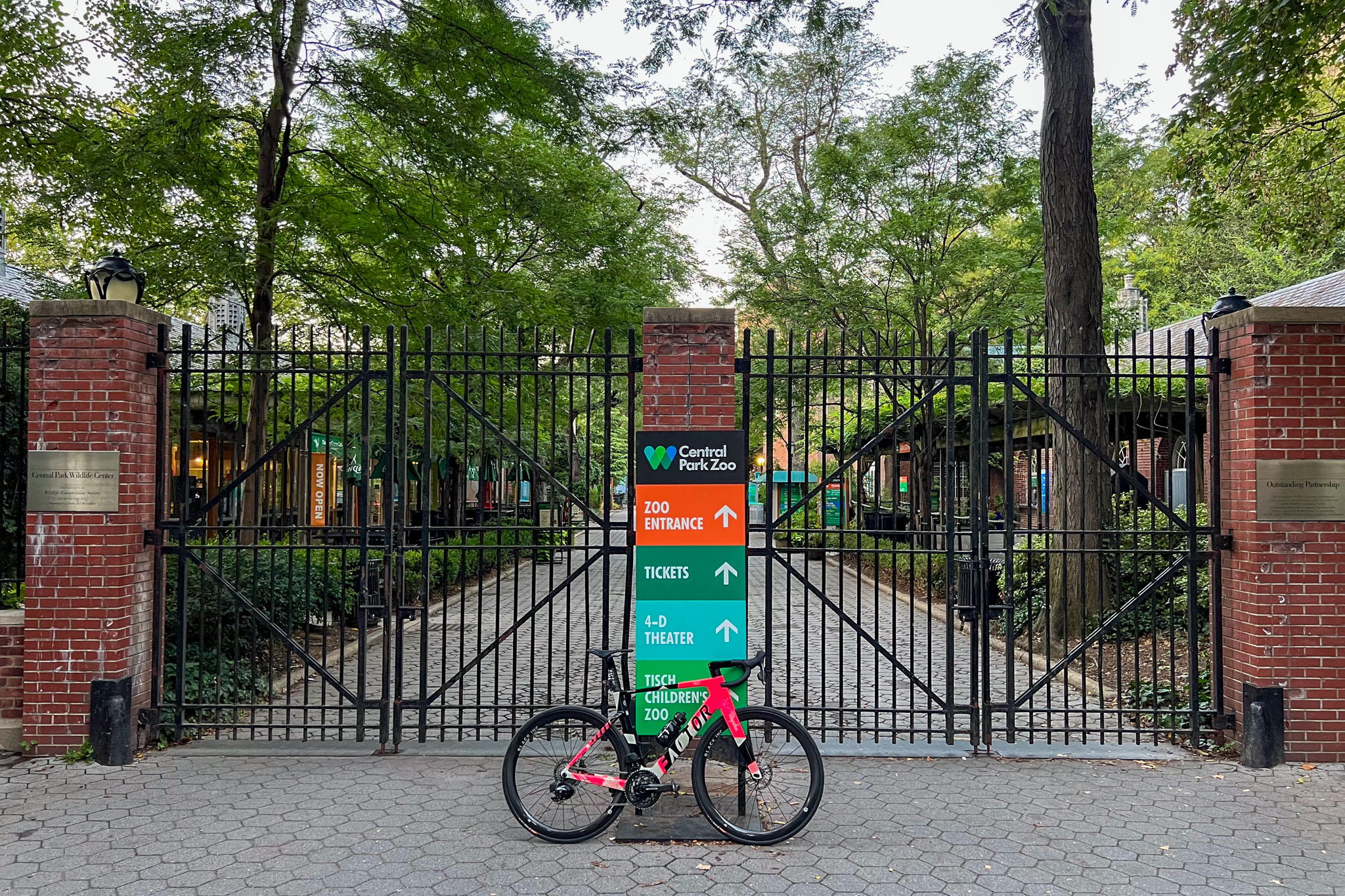 Factor Monza bicycle parked in front of the gates at Central Park Zoo.