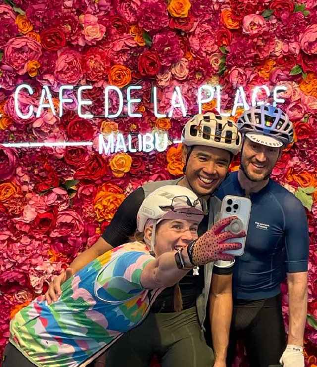 Cyclists taking a selfie together at Cafe de la Plage in Malibu, CA